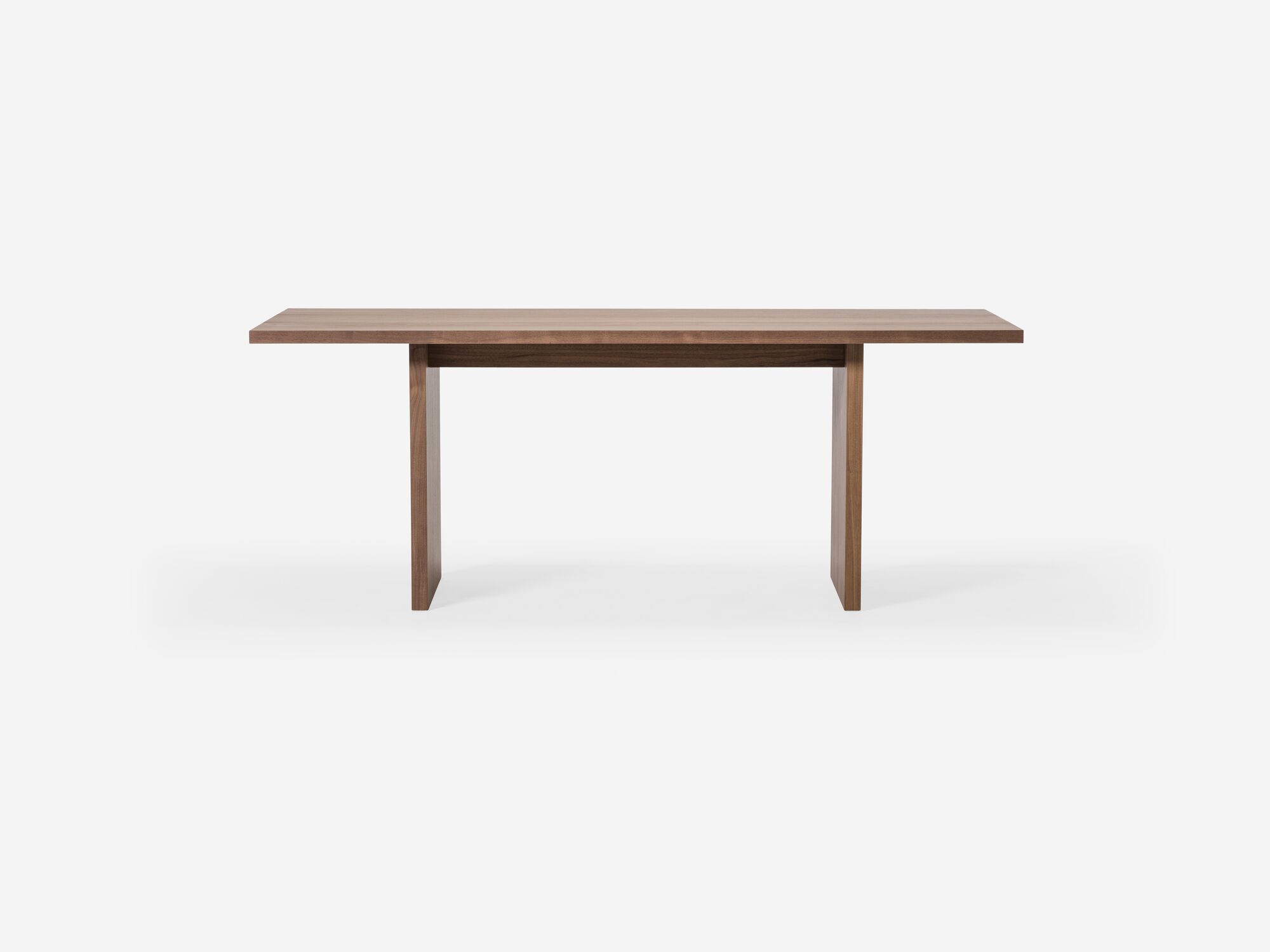 Front view of walnut dining table with two legs